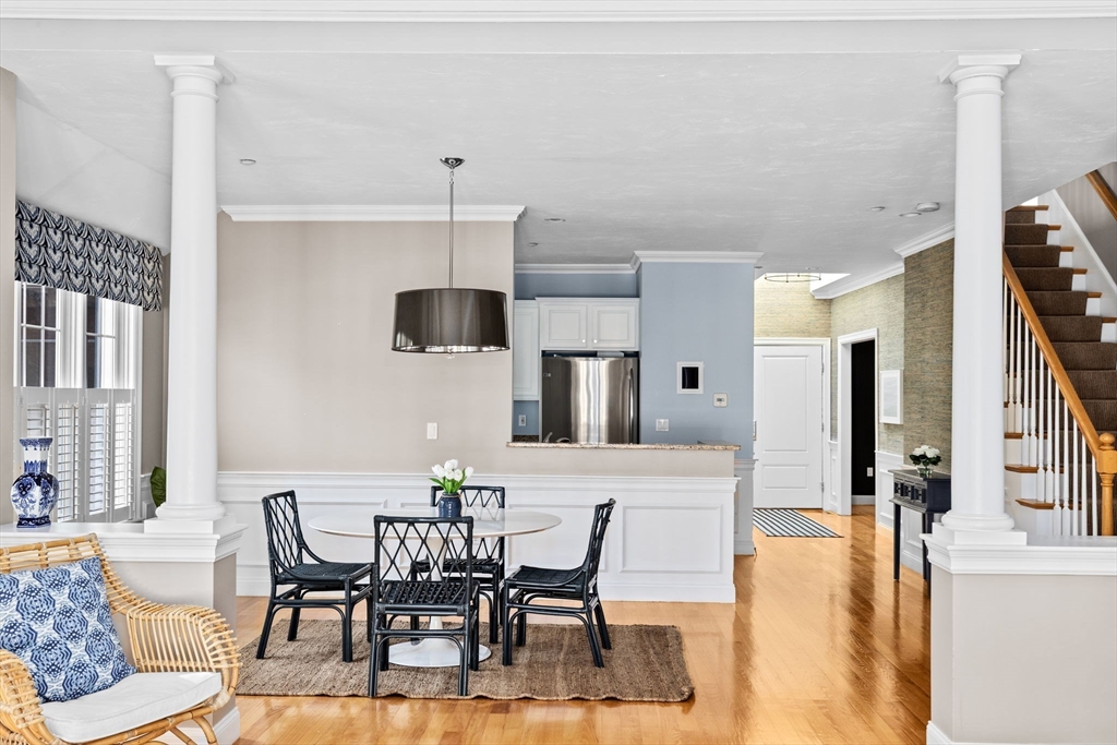 239 Washington Street, Unit 9 Norwell, MA 02061 - Photo 2 of 27 a view of a dining room with furniture and wooden floor