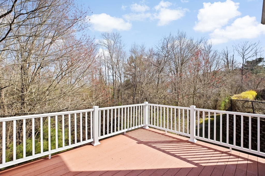 239 Washington Street, Unit 9 Norwell, MA 02061 - Photo 25 of 27 a view of a wooden roof deck