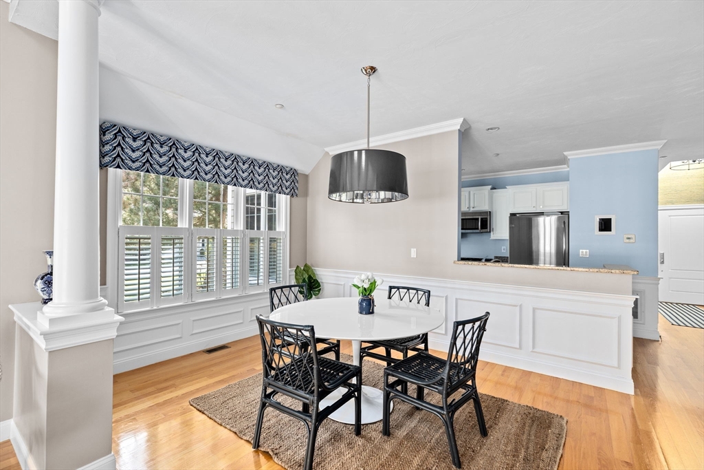 239 Washington Street, Unit 9 Norwell, MA 02061 - Photo 3 of 27 a view of a dining room with furniture window and wooden floor