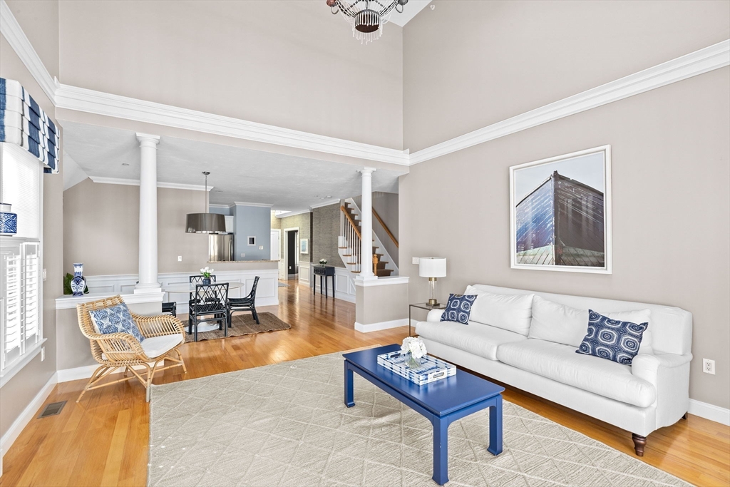 239 Washington Street, Unit 9 Norwell, MA 02061 - Photo 5 of 27 a living room with furniture and a table