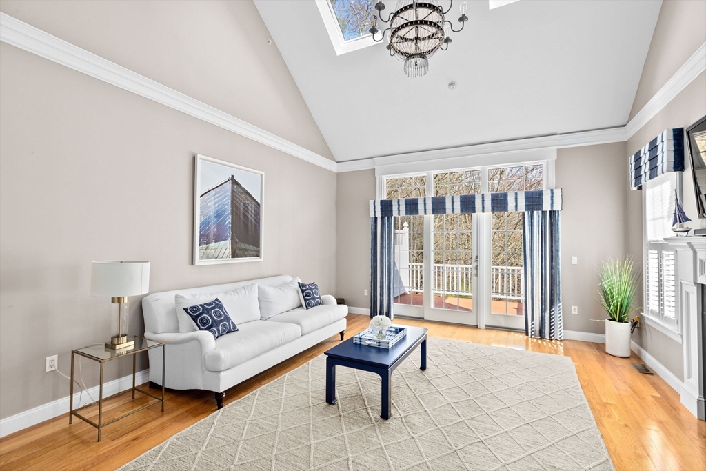 239 Washington Street, Unit 9 Norwell, MA 02061 - Photo 6 of 27 a living room with furniture and a window with outer view