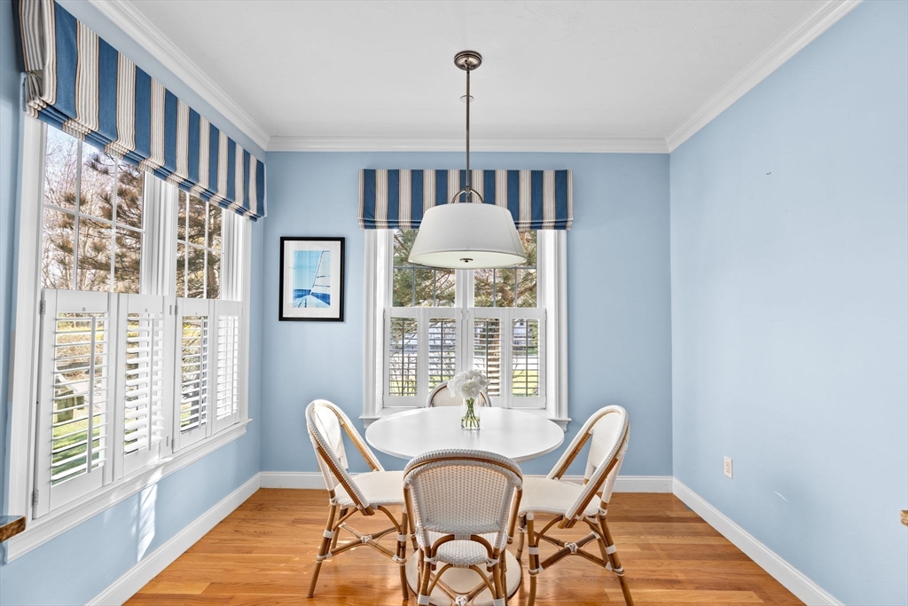 239 Washington Street, Unit 9 Norwell, MA 02061 - Photo 10 of 27 a view of a dining room with furniture window and wooden floor