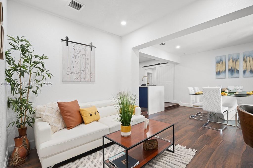 445 Southwest 62nd Court Miami, FL 33144 - Photo 11 of 41 a living room with furniture and wooden floor