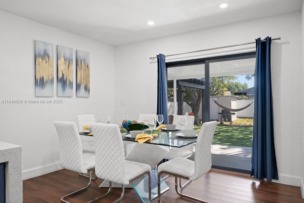 445 Southwest 62nd Court Miami, FL 33144 - Photo 12 of 41 a dining room with furniture window and wooden floor