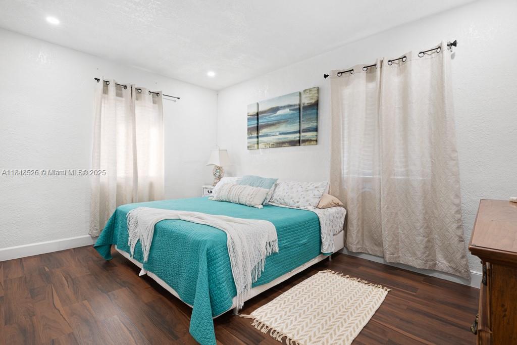 445 Southwest 62nd Court Miami, FL 33144 - Photo 20 of 41 a bedroom with a bed and a mirror