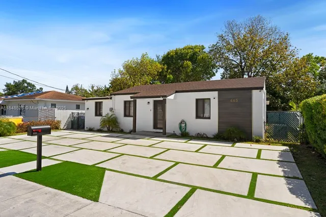 a front view of a house with a patio