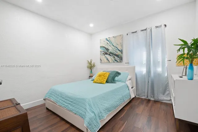 a bedroom with a bed and a table