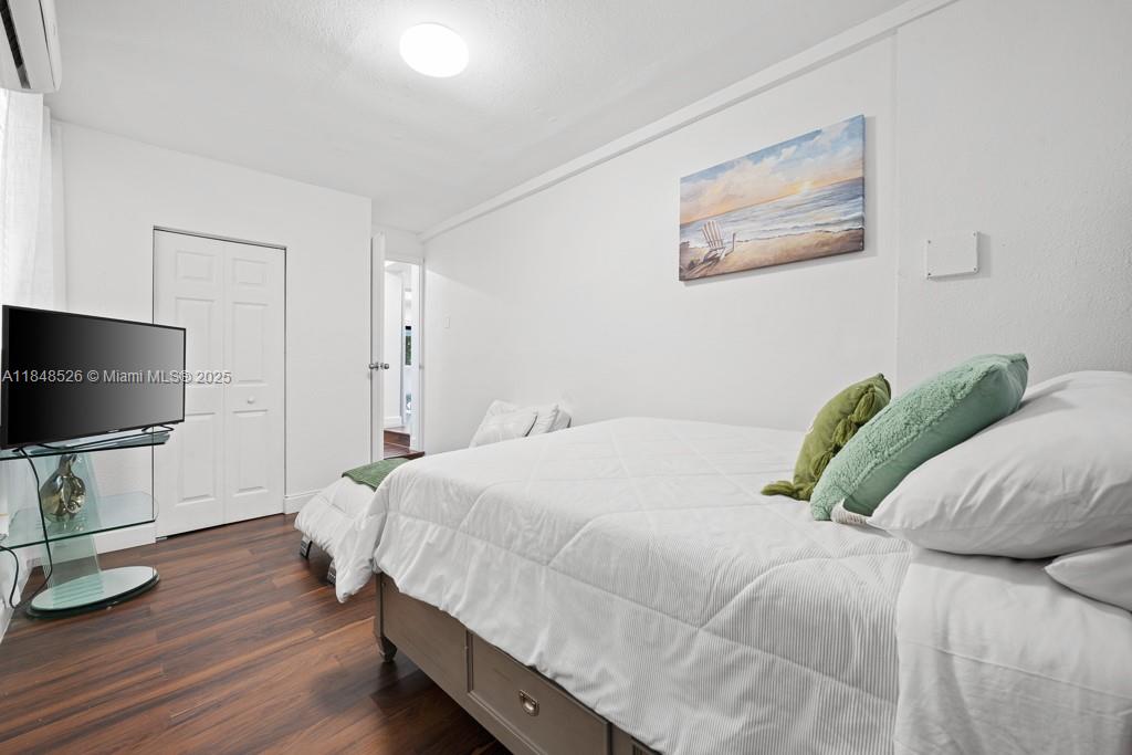 445 Southwest 62nd Court Miami, FL 33144 - Photo 31 of 41 a bedroom with a bed and flat screen tv