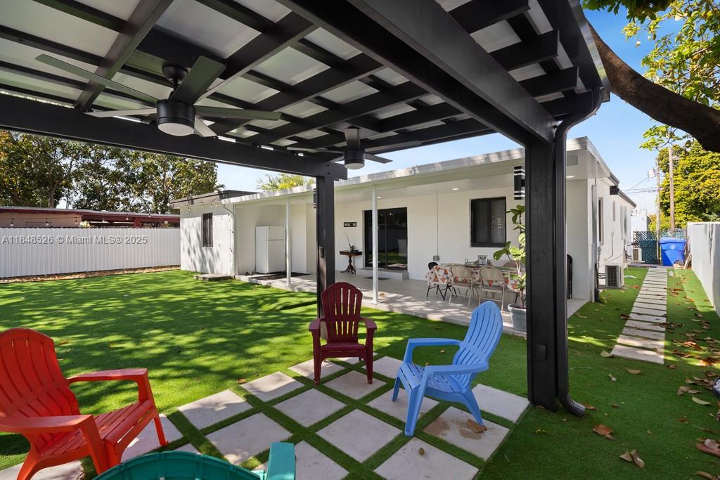 445 Southwest 62nd Court Miami, FL 33144 - Photo 37 of 41 a view of a chairs and table in patio with a backyard