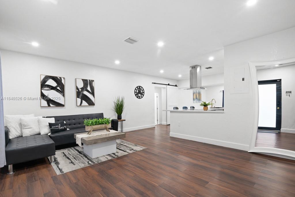 445 Southwest 62nd Court Miami, FL 33144 - Photo 6 of 41 a living room with furniture and kitchen view