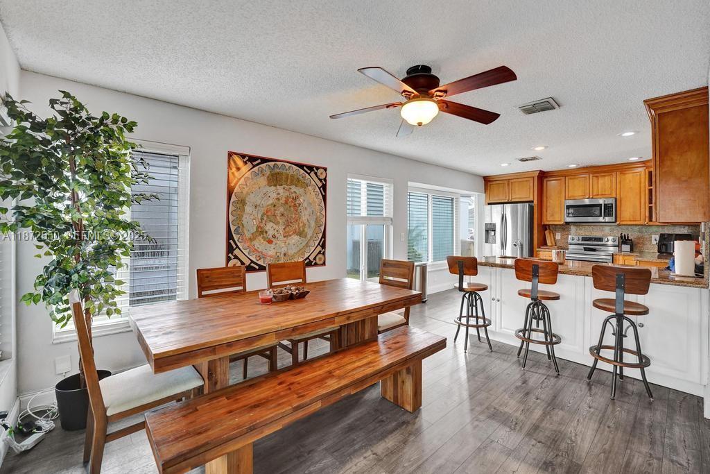 2747 Pinewood Court Davie, FL 33328 - Photo 14 of 25 a living room with furniture and a large window