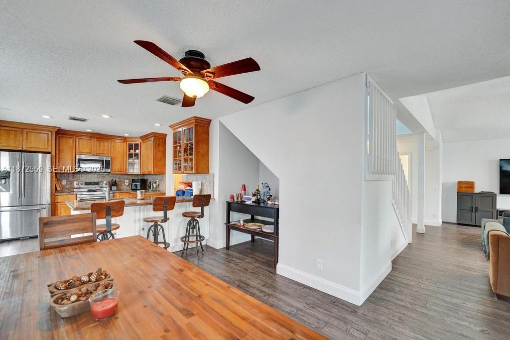 2747 Pinewood Court Davie, FL 33328 - Photo 15 of 25 a living room with furniture and kitchen view