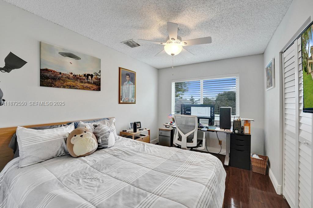 2747 Pinewood Court Davie, FL 33328 - Photo 16 of 25 a bedroom with a bed and furniture