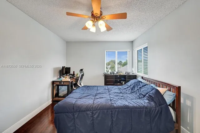 a bedroom with a bed and a table in it