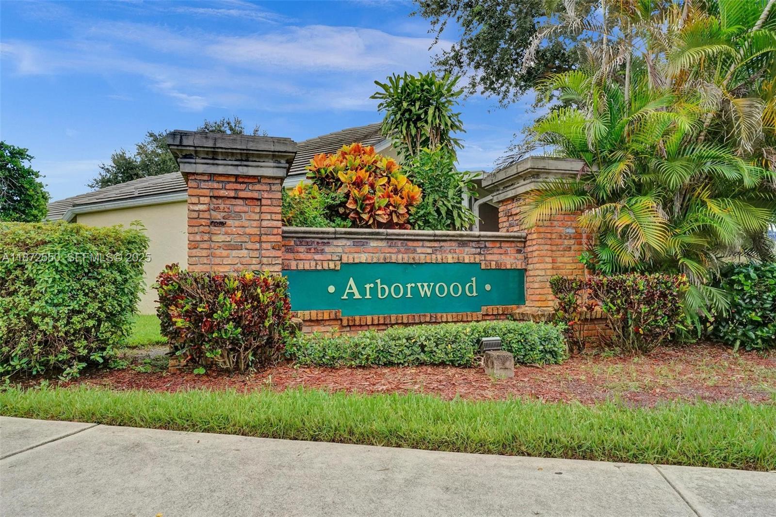 2747 Pinewood Court Davie, FL 33328 - Photo 20 of 25 a view of a sign in a garden