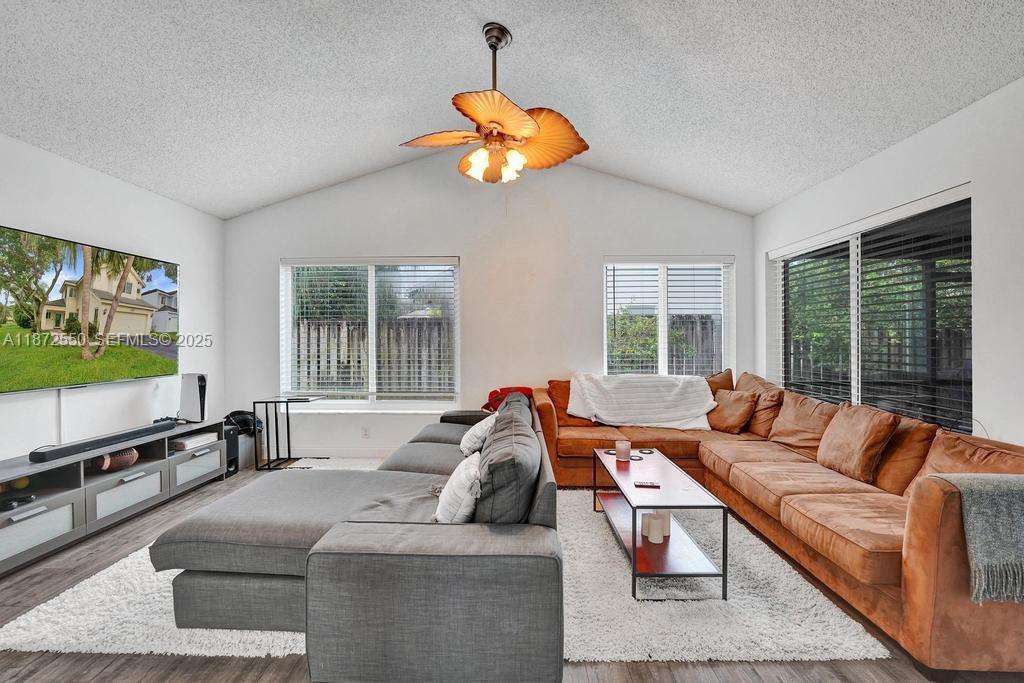 2747 Pinewood Court Davie, FL 33328 - Photo 5 of 25 a living room with furniture and a flat screen tv