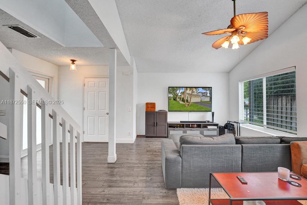 2747 Pinewood Court Davie, FL 33328 - Photo 6 of 25 a living room with furniture and a large window