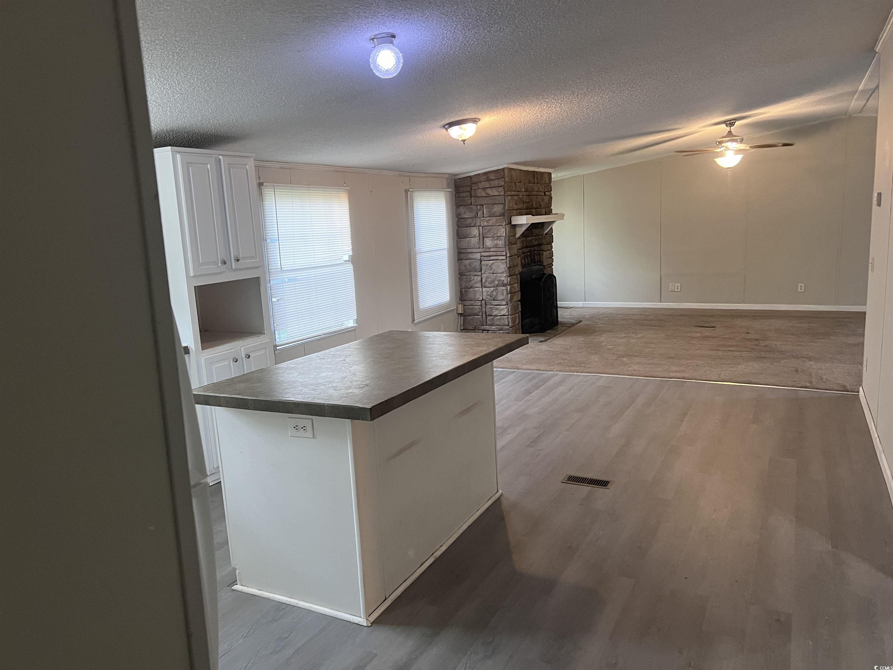 159 Jeffcoat Bridge Road North, SC 29112 - Photo 11 of 17 Kitchen with dark countertops, a textured ceiling,