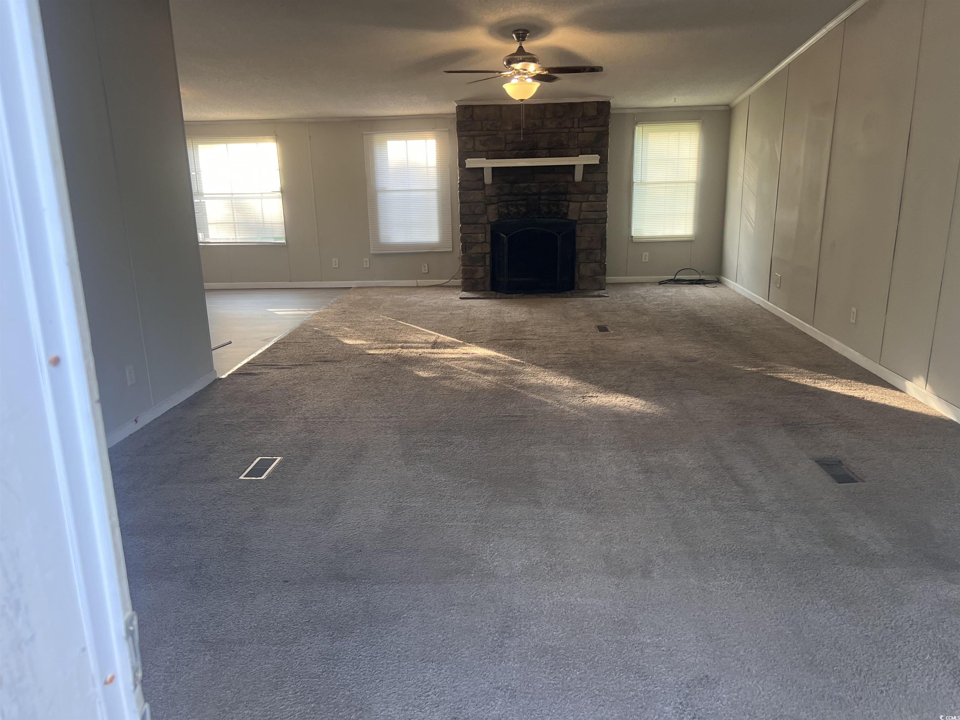 159 Jeffcoat Bridge Road North, SC 29112 - Photo 4 of 17 Unfurnished living room featuring a ceiling fan, h