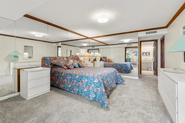 a bedroom with bed and window