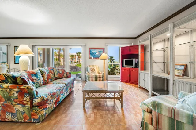 a living room with furniture fireplace and flat screen tv