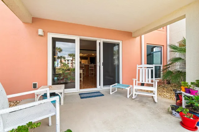 a view of backyard with outdoor seating