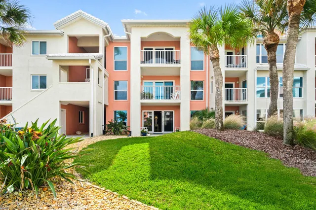 a view of a building with a yard