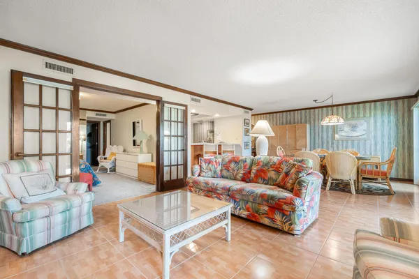 a living room with furniture and a large window