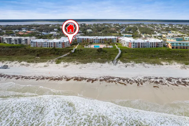 a house with a swimming pool and outdoor seating