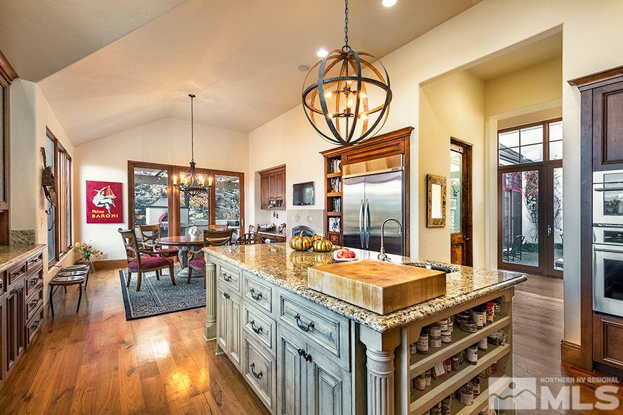 50 Lonepine Court Reno, NV 89519 - Photo 12 of 23 a large kitchen with a table and chairs