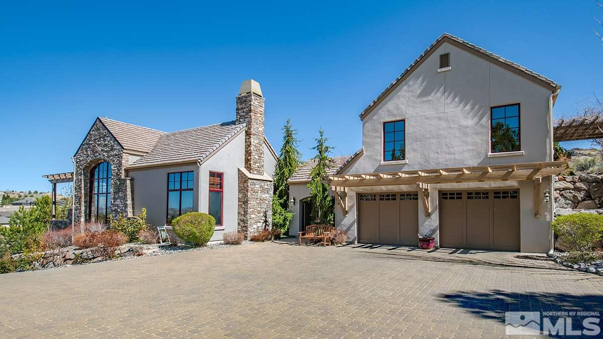 50 Lonepine Court Reno, NV 89519 - Photo 3 of 23 a front view of a house with a yard and garage