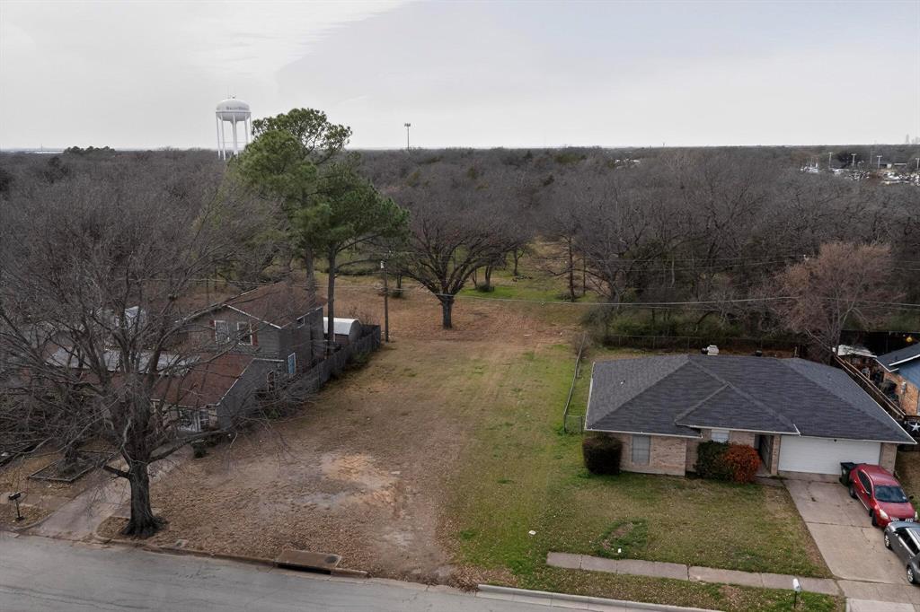 3800 Pioneer Road Balch Springs, TX 75180 - Photo 12 of 17 an aerial view of a house with yard and mountain view in back