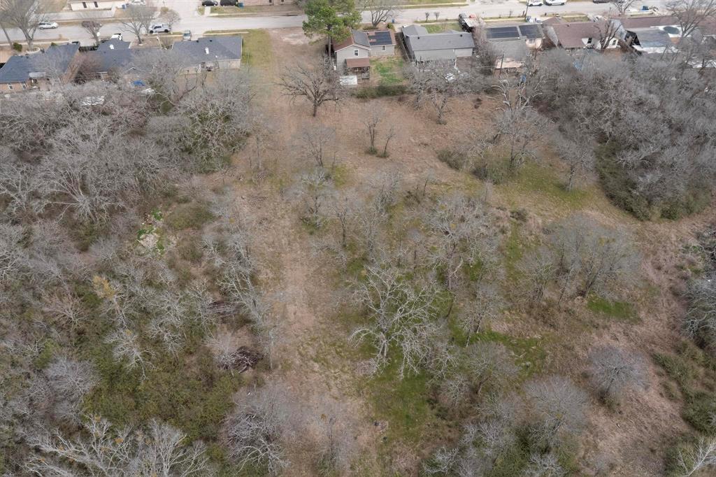 3800 Pioneer Road Balch Springs, TX 75180 - Photo 13 of 17 a view of a dry yard with houses