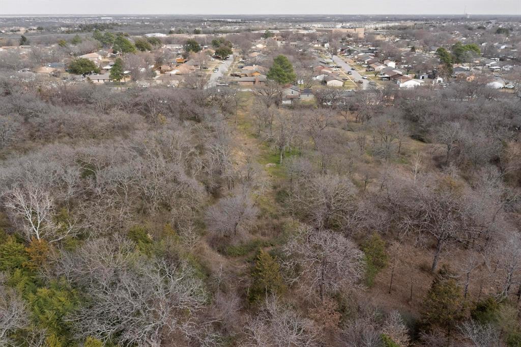 3800 Pioneer Road Balch Springs, TX 75180 - Photo 8 of 17 an aerial view of residential houses with outdoor space and trees