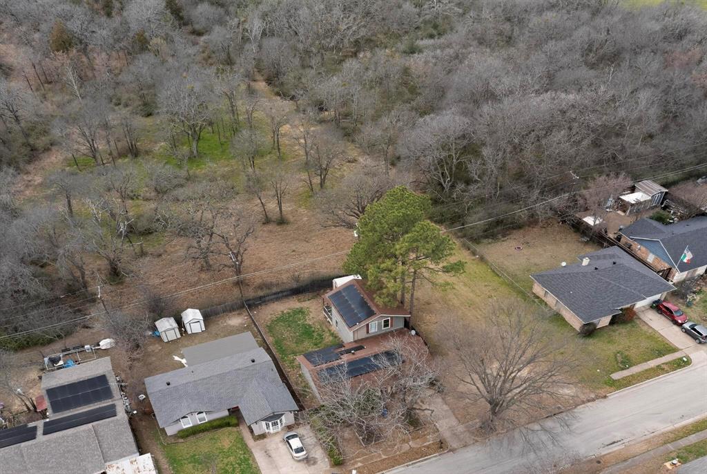 3800 Pioneer Road Balch Springs, TX 75180 - Photo 9 of 17 an aerial view of a house with a yard