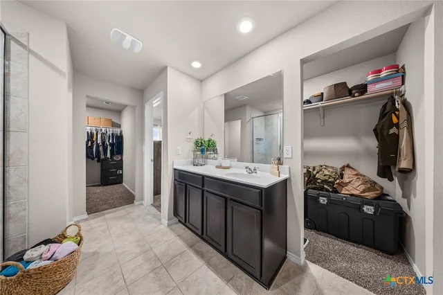 a kitchen with a sink and cabinets