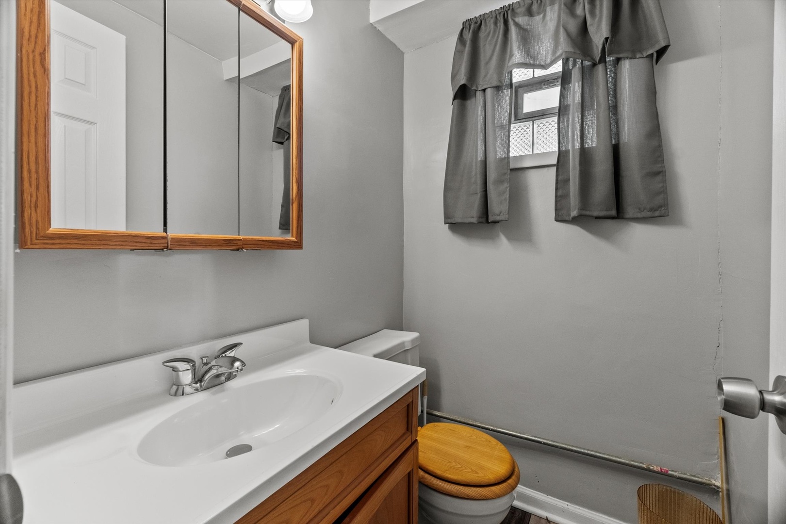 11417 South Church Street Chicago, IL 60643 - Photo 9 of 24 a bathroom with a sink toilet and mirror