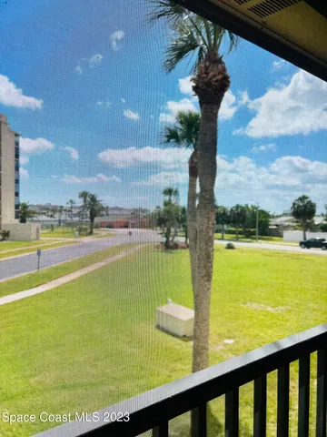 a view of a swimming pool and an outdoor seating
