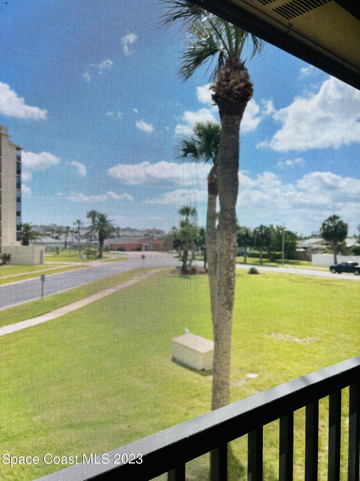 416 School Road, Unit 204 Indian Harbour Beach, FL 32937 - Photo 14 of 14 a view of a swimming pool and an outdoor seating