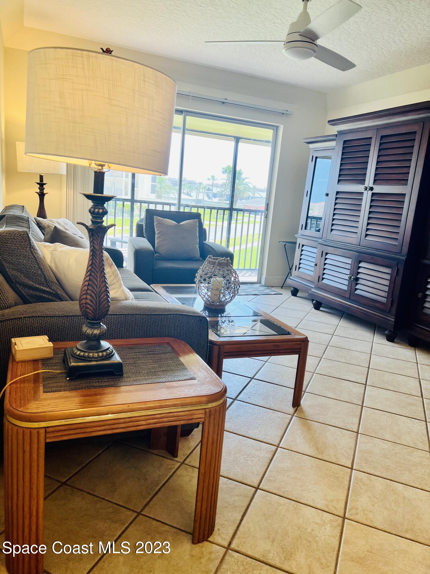 416 School Road, Unit 204 Indian Harbour Beach, FL 32937 - Photo 5 of 14 a living room with furniture