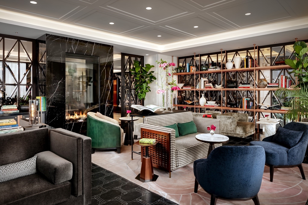 40 Trinity Place, Unit 33F Boston, MA 02116 - Photo 24 of 25 a work room with furniture and book shelf