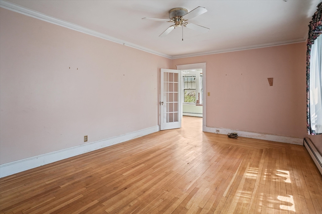 57 Olive Street Methuen, MA 01844 - Photo 12 of 38 wooden floor in an empty room with a window
