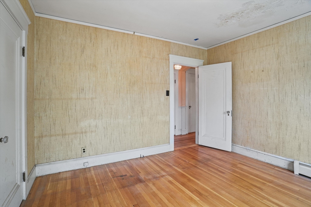 57 Olive Street Methuen, MA 01844 - Photo 15 of 38 a view of an empty room with wooden floor