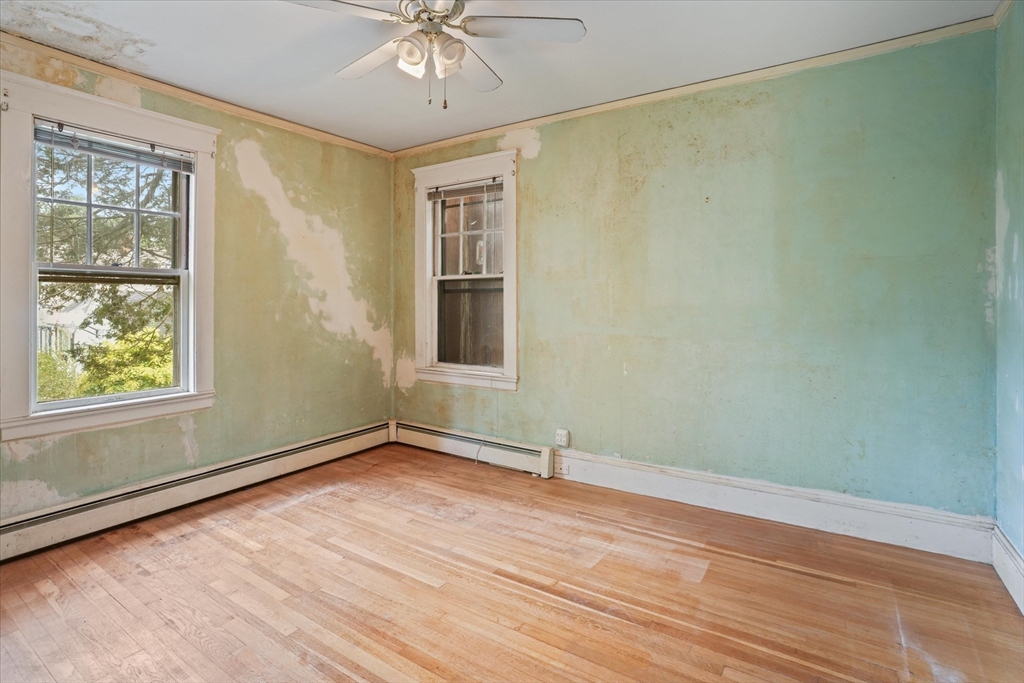 57 Olive Street Methuen, MA 01844 - Photo 16 of 38 wooden floor in an empty room with a window