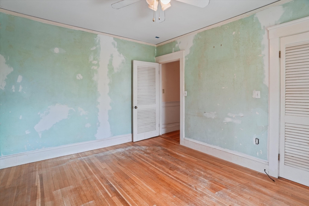57 Olive Street Methuen, MA 01844 - Photo 17 of 38 a view of a big room with wooden floor and a chandelier fan