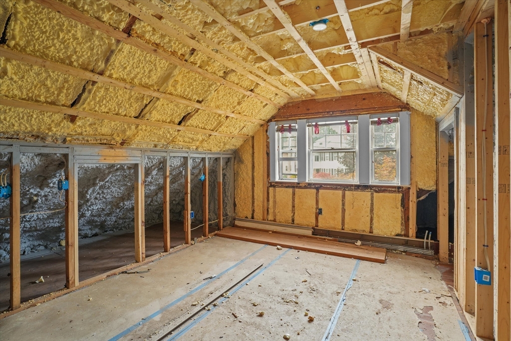 57 Olive Street Methuen, MA 01844 - Photo 19 of 38 a view of a house with a wooden fence