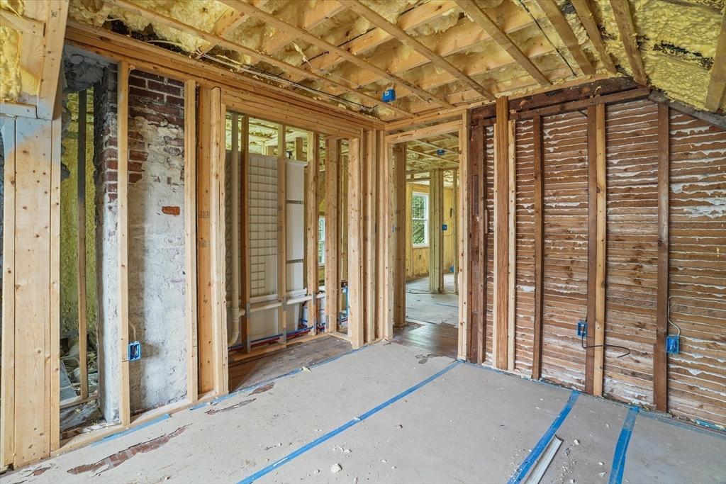 57 Olive Street Methuen, MA 01844 - Photo 21 of 38 a bedroom with a bed and wooden floor