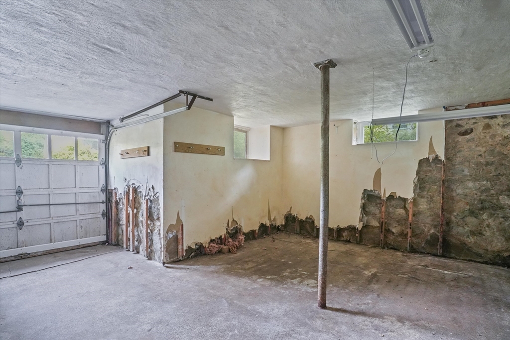 57 Olive Street Methuen, MA 01844 - Photo 25 of 38 a view of a room with a garage