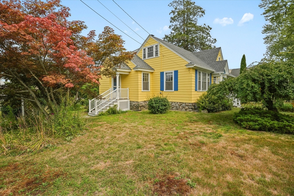 57 Olive Street Methuen, MA 01844 - Photo 28 of 38 a front view of a house with garden