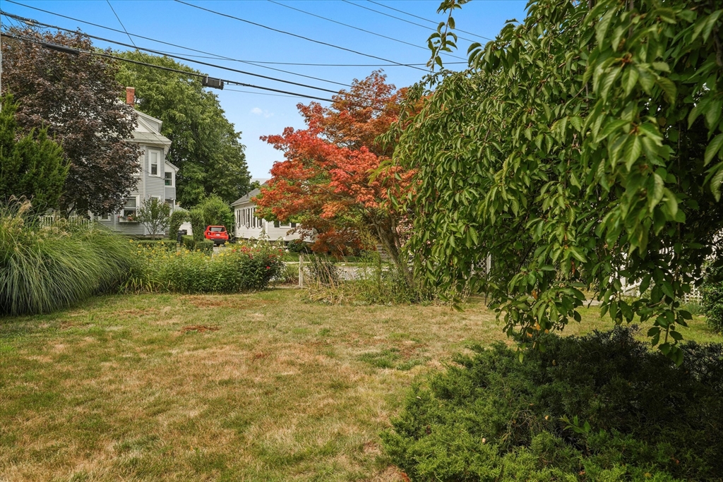 57 Olive Street Methuen, MA 01844 - Photo 33 of 38 a view of a field with trees in the background